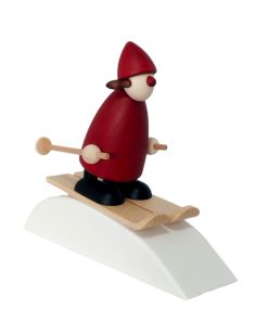 Weihnachtsfrau auf Ski mit Schneehügel